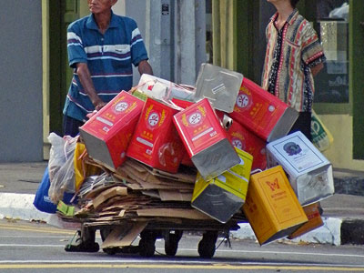 Recycling man - hit the jackpot with those canisters - will be able to eat well tonight - Jalan Sultan - Singapore