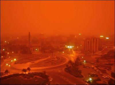 A sandstorm hit the center of Baghdad, which was already ringed with plumes of thick smoke billowing from burning oil trenches