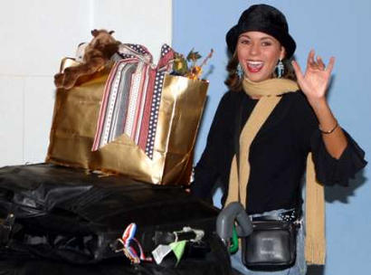 U.S. Miss World (news - web sites) contestant Rebekah Revels smiles as she arrives at London's Gatwick Airport, November 24, 2002