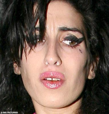 Another hard day's night: Amy Winehouse out until 5am with a mystery white powder up her nose