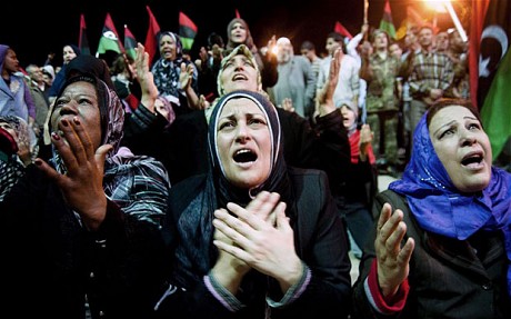 People celebrate after the UN authorized a no-fly zone over Libya, in Benghaz