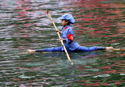 Contestants sail on bamboo