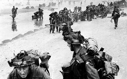 Live and dead Tommies on the beach in Normandy