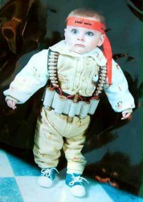 A two year old dressed as a suicide bomber